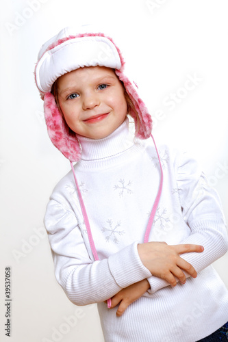 Kid in winter wear against white background