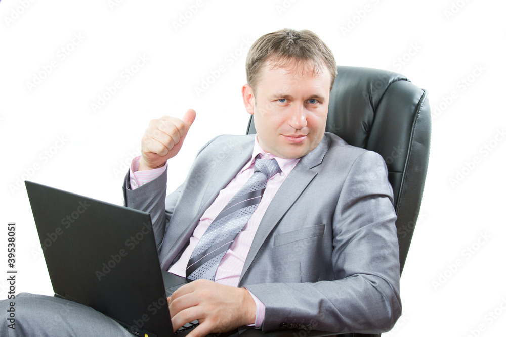 successful man with modern laptop showing thumbs up successful man with modern laptop showing thumbs up