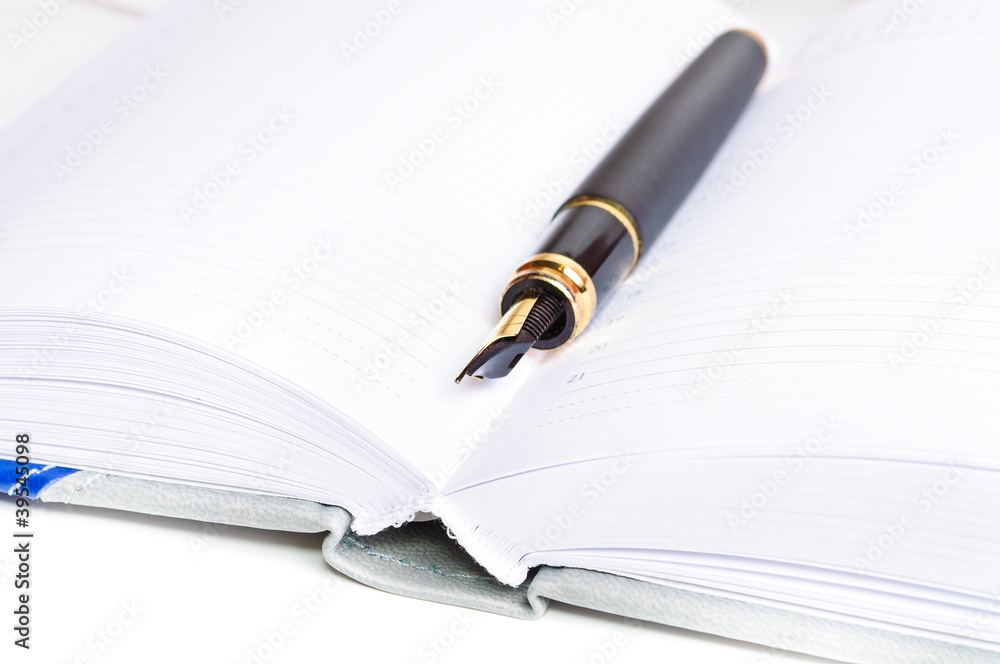 Ink pen and a notebook Ink pen and a notebook
