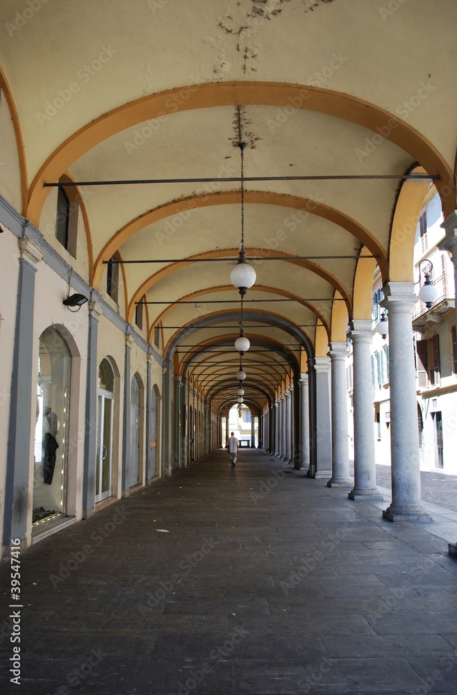 Ancient arched portico in town center, Novara, Piedmont, Italy