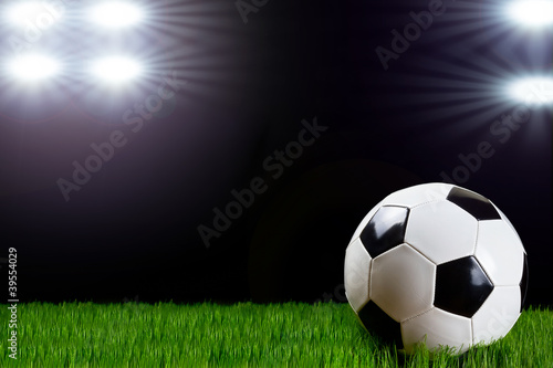 Soccer ball in the stadium lights © Patryk Kosmider