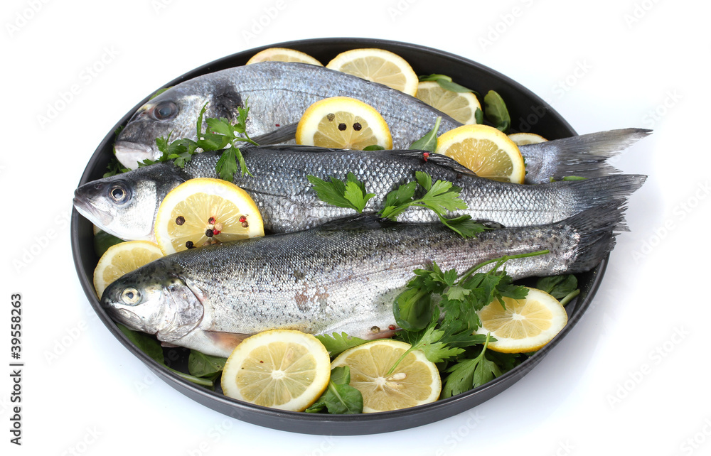 Fresh fishes with lemon, parsley and pepper Fresh fishes with lemon, parsley and pepper