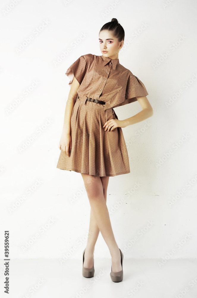Attractive young fashion woman standing on podium Attractive young fashion woman standing on podium