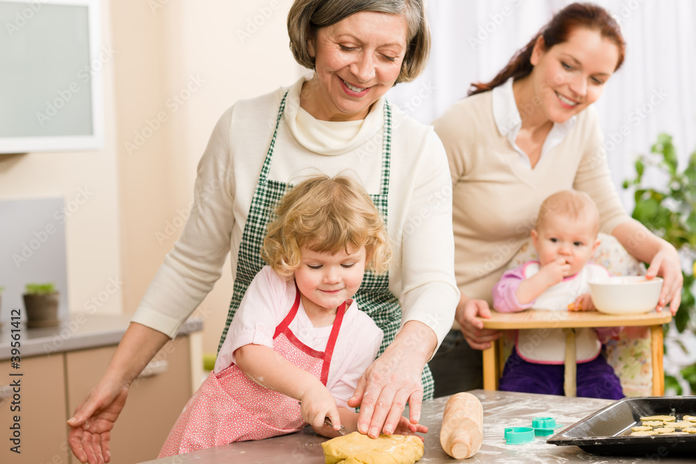 Little girl cutting dough for cookies Little girl cutting dough for cookies