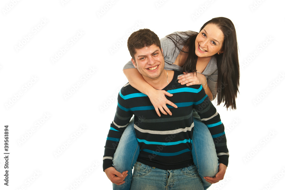 Laughing couple in piggy back Laughing couple in piggy back