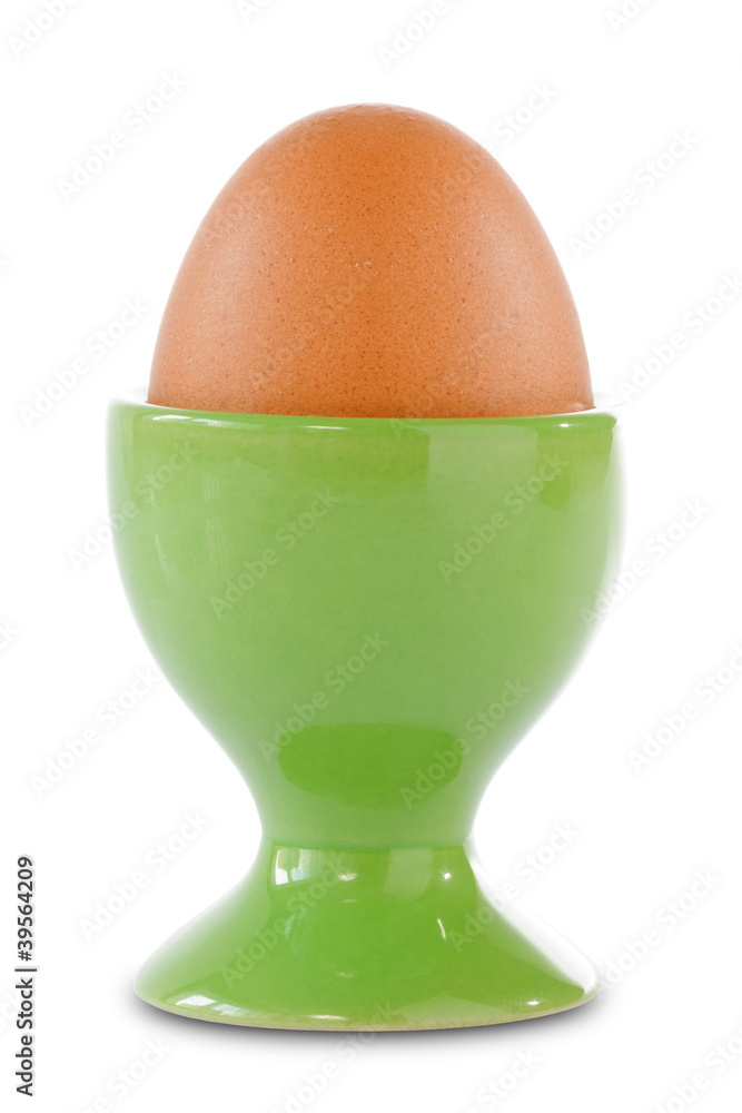 Brown egg in a green cup Brown egg in a green cup