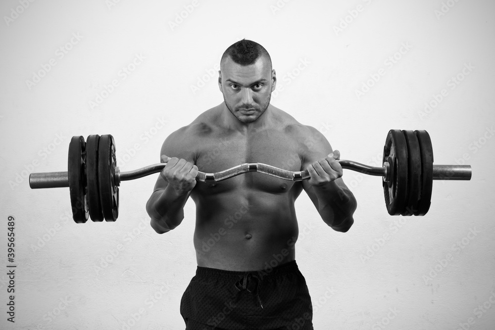 Fototapeta premium Man lifting weights