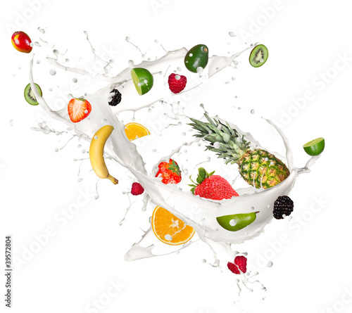 Fruits pieces falling in milk splash,isolated on white