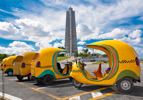 Typical cuban coconut shaped taxis in Havana © kmiragaya