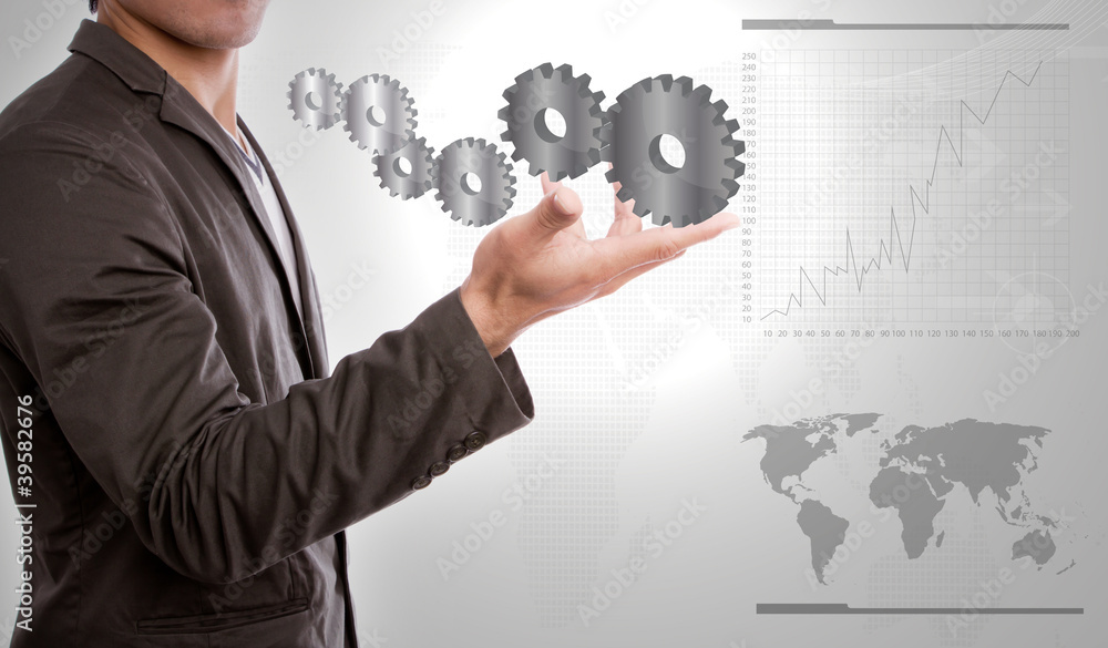 Businessperson holding gears of success in hand Businessperson holding gears of success in hand