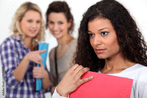 Students gossiping about a young woman