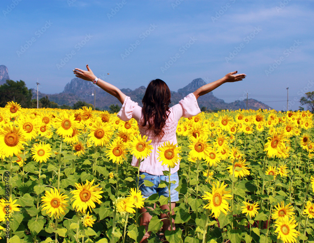 Women in the field of sunflowers Women in the field of sunflowers