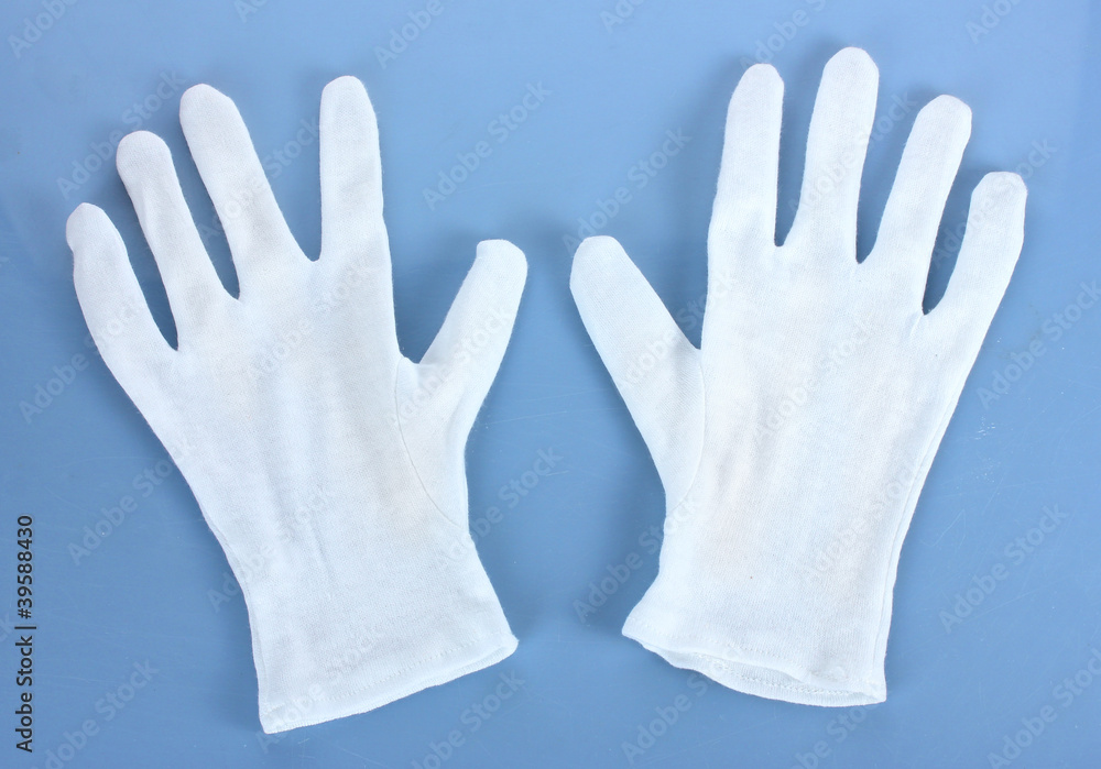 cloth gloves on blue background. cloth gloves on blue background.