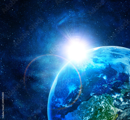 Fototapeta Naklejka Na Ścianę i Meble -  blue earth in space with rising sun
