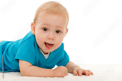 Cheerful baby boy on the blanket