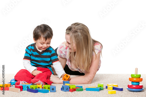 Playing on the carpet mother and a little son