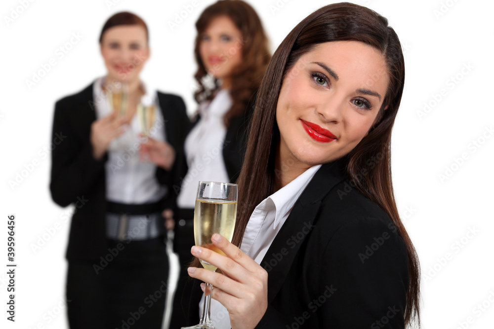 Business women drinking champagne Business women drinking champagne