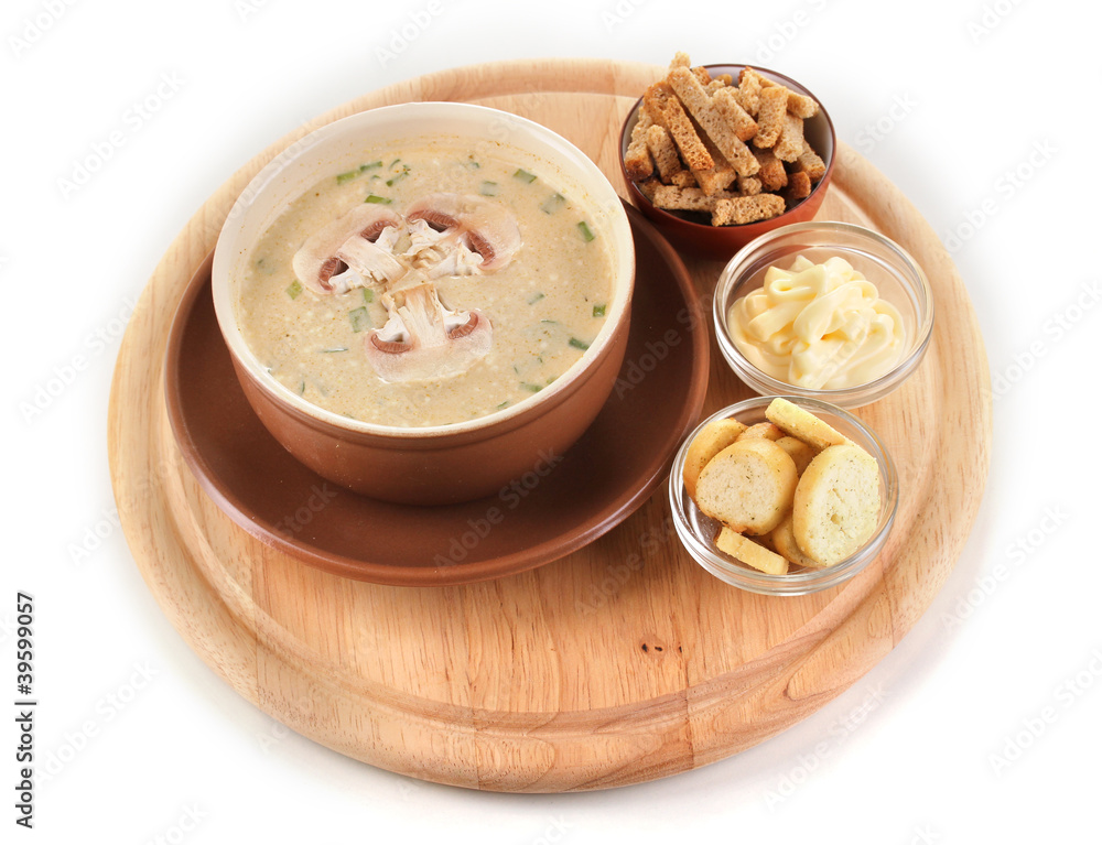 Tasty soup on wooden round board isolated on white Tasty soup on wooden round board isolated on white