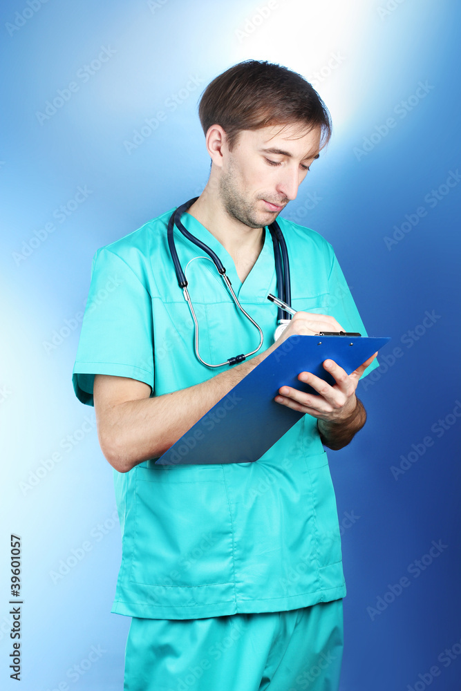 young doctor man with stethoscope and folde young doctor man with stethoscope and folde