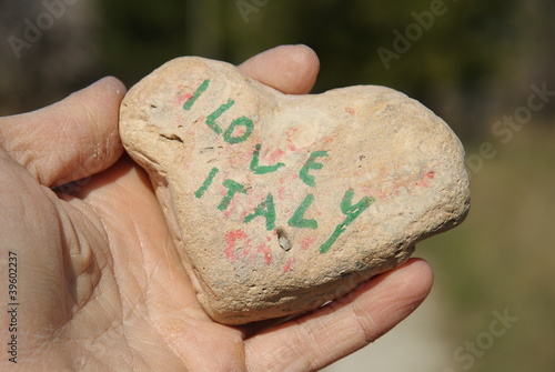 I love Italy, stone heart on a dry hand palm