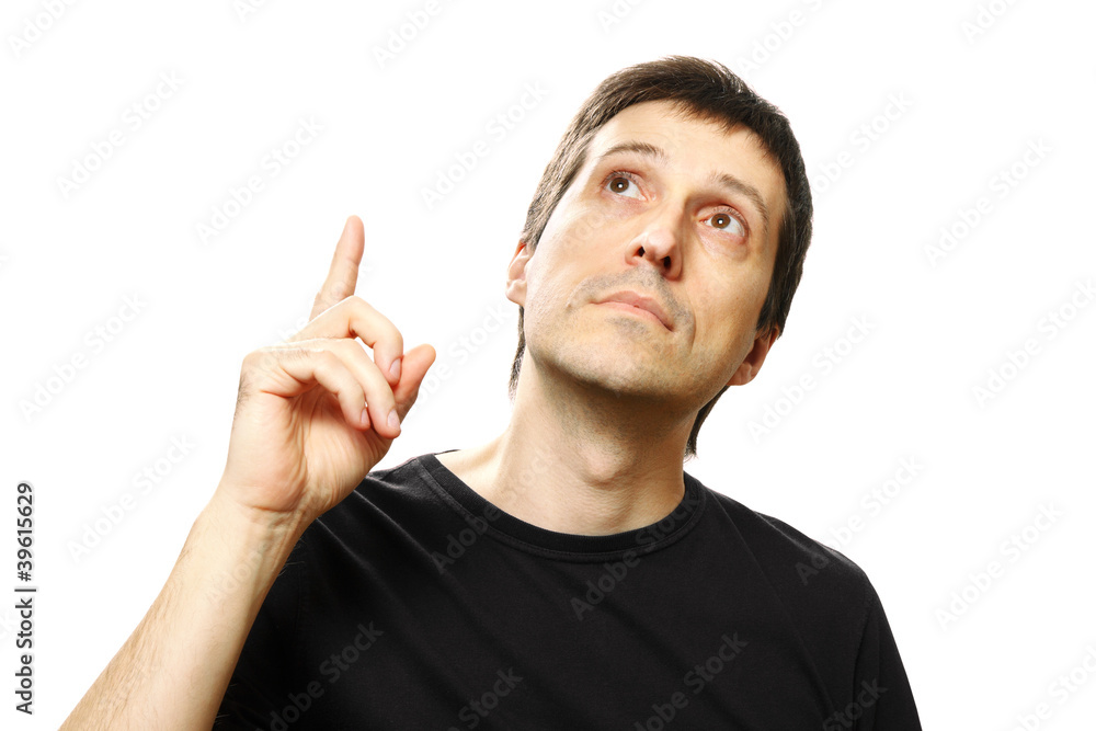 young man pointing up and looking upwards on white background young man pointing up and looking upwards on white background