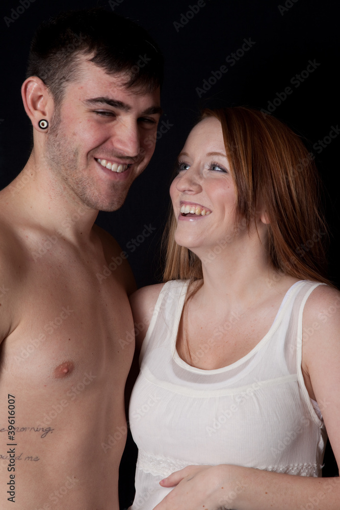 couple he is shirtless, both smiling