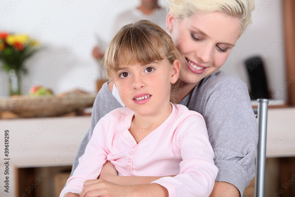 Woman hugging her daughter