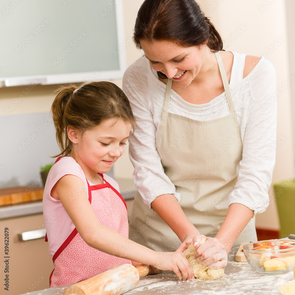 Mother and daughter prepare dough home cake Mother and daughter prepare dough home cake