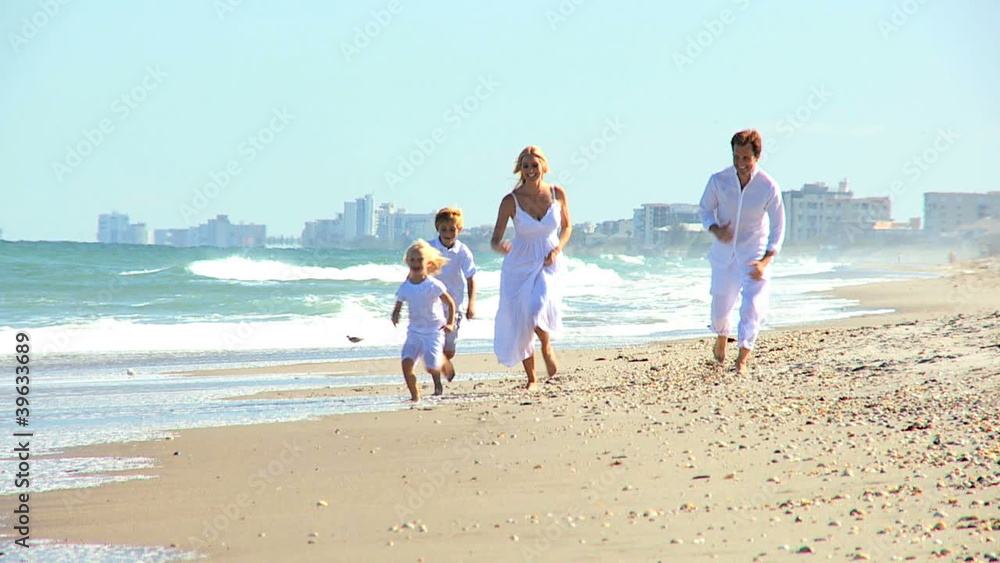 Happy Caucasian Family Running on Beach Happy Caucasian Family Running on Beach