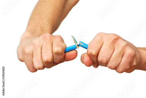 Hands breaking pencil