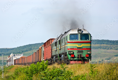 Heavy freight train pulled by diesel locomotive