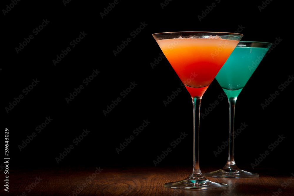 Red and blue cocktails on a black background