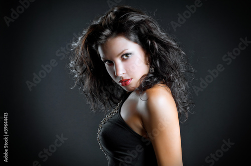 art fashion photo of portrait young woman on dark