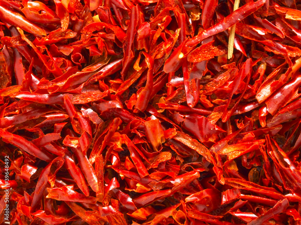 Fototapeta premium close up of red dried chili flakes food background