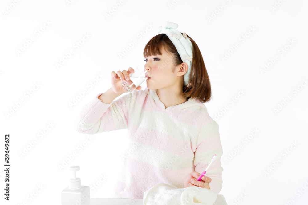 Beautiful young woman brushing her teeth Beautiful young woman brushing her teeth