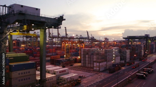 Massive Crane in a busy harbor during evening