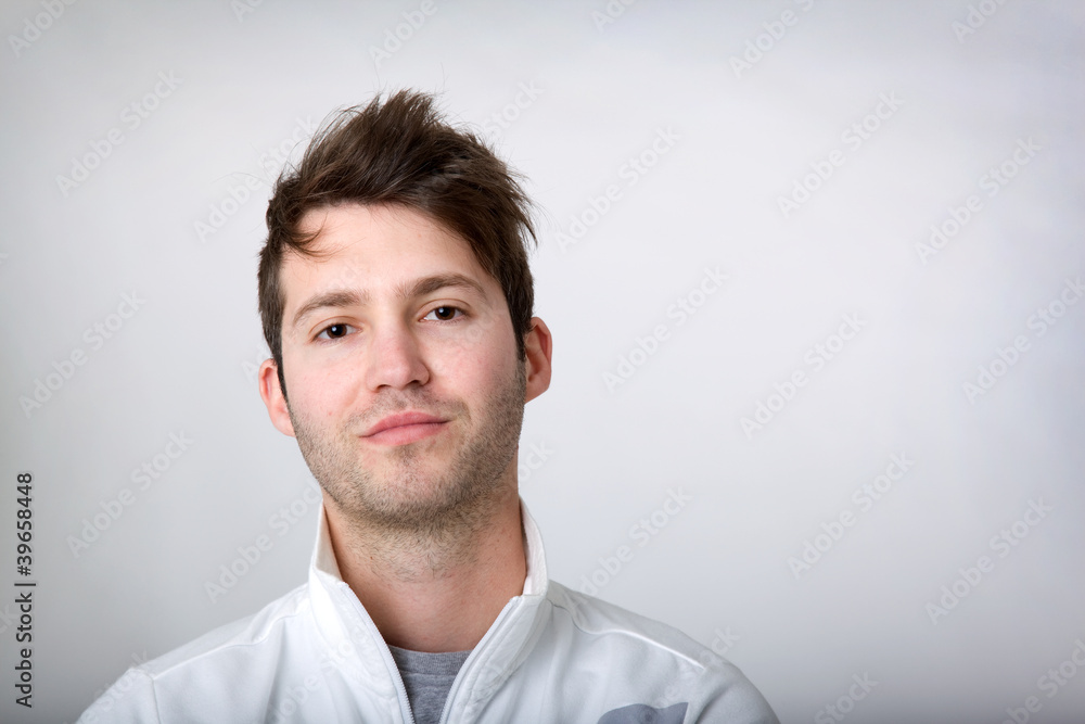 Handsome young man portrait on gray background Handsome young man portrait on gray background