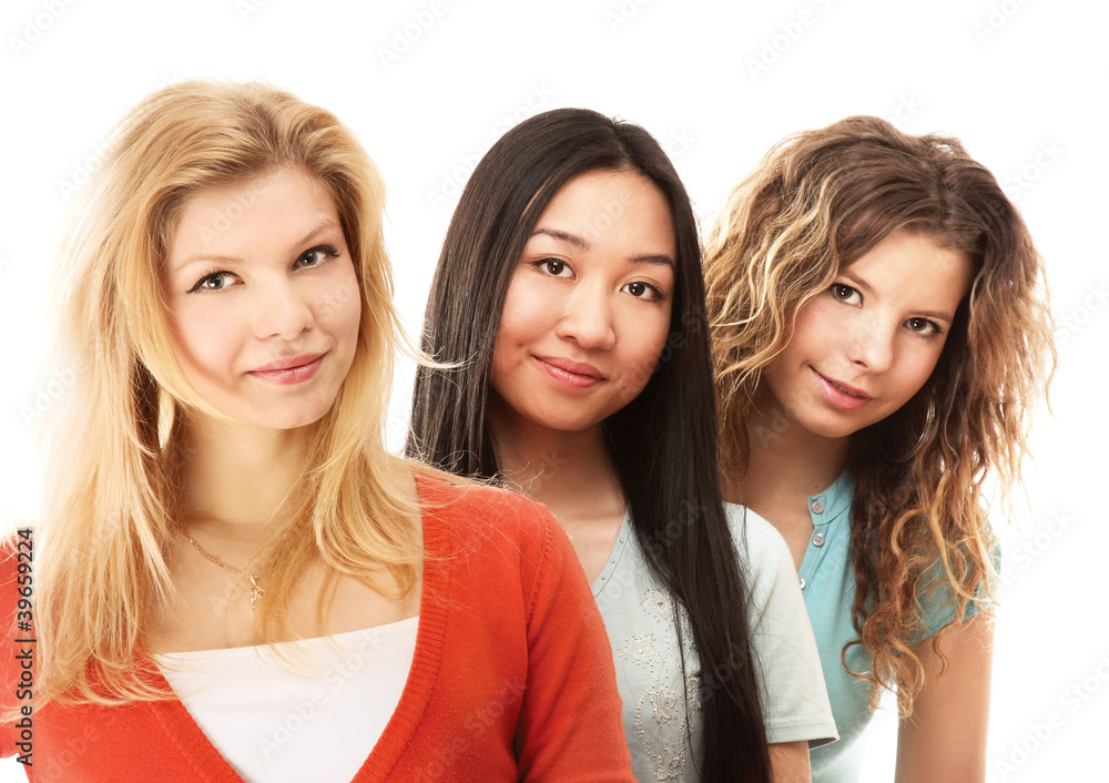 Three yong girls standing isolated on white background Three yong girls standing isolated on white background