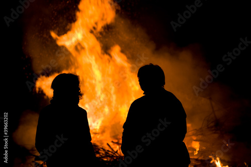 people in front of big fire