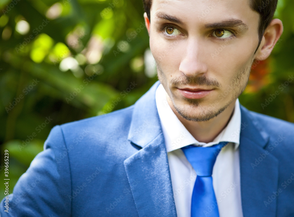 good looking beautiful young man in costume outdoors. good looking beautiful young man in costume outdoors.