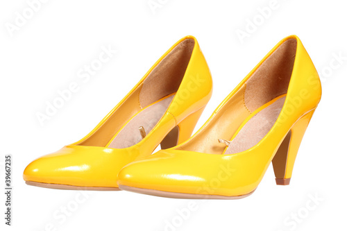 A pair of yellow women's heel shoes with clipping path.