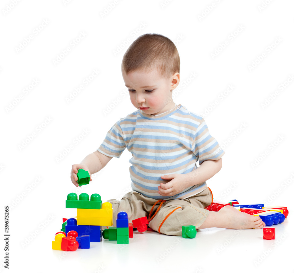 little cheerful child playing with construction set over white b little cheerful child playing with construction set over white b