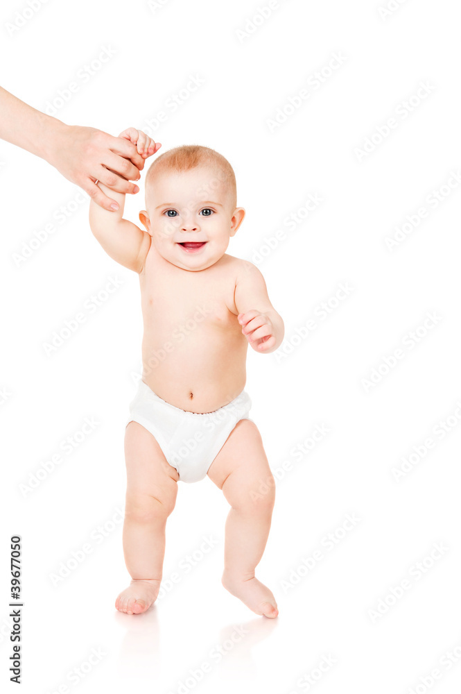 smiling child walking hand in hand with mom smiling child walking hand in hand with mom