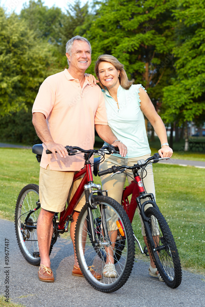 Senior couple cycling.