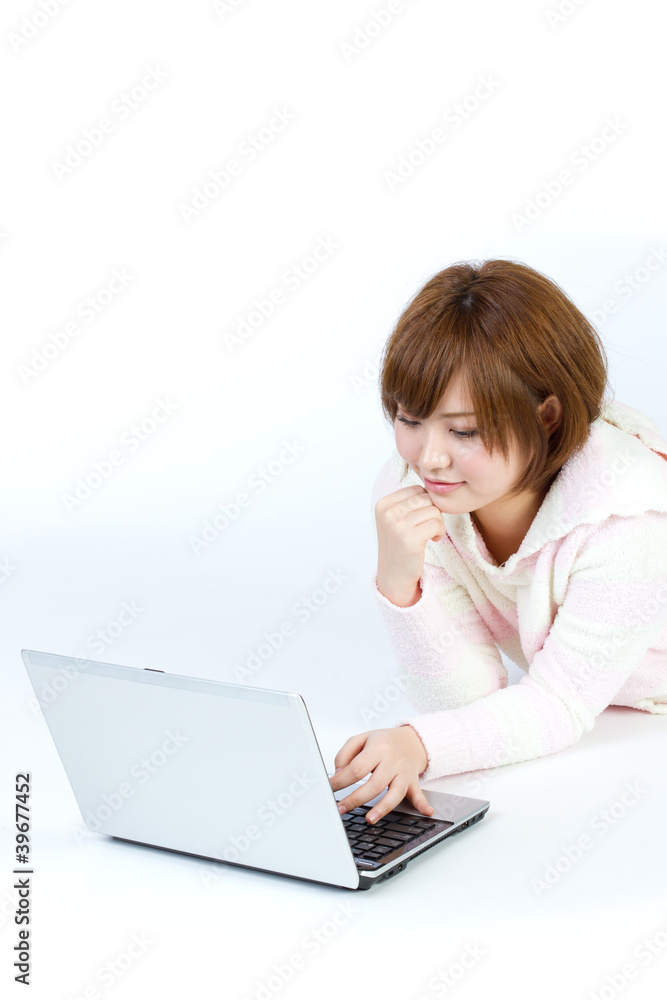 Beautiful asian woman using a laptop computer Beautiful asian woman using a laptop computer