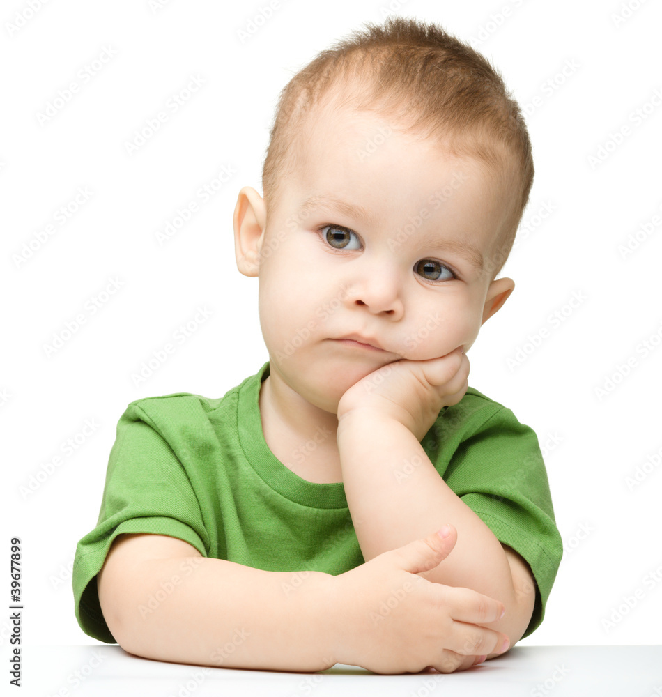 Portrait of a cute and pensive little boy