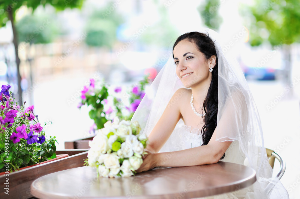 Happy young bride holding bridal bouquet Happy young bride holding bridal bouquet