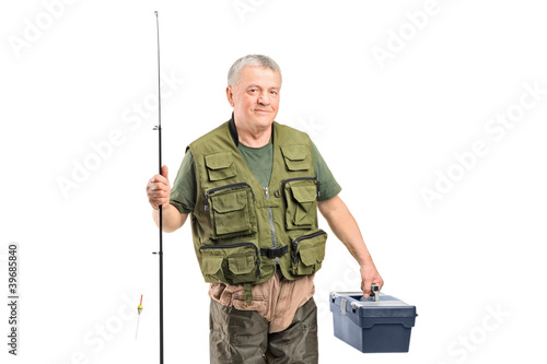 A mature fisherman holding a fishing equipment