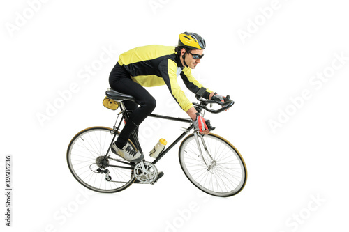 Fototapeta Naklejka Na Ścianę i Meble -  A young man riding a bicycle