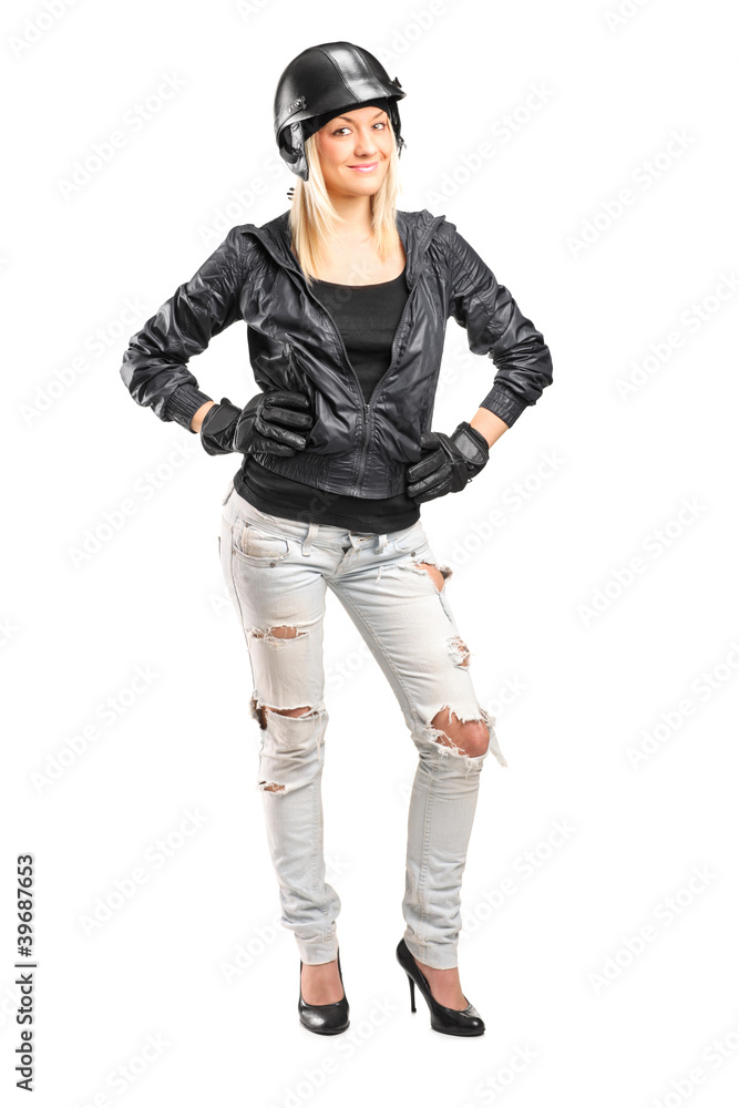 Full length portrait of a female motorcycler with helmet Full length portrait of a female motorcycler with helmet